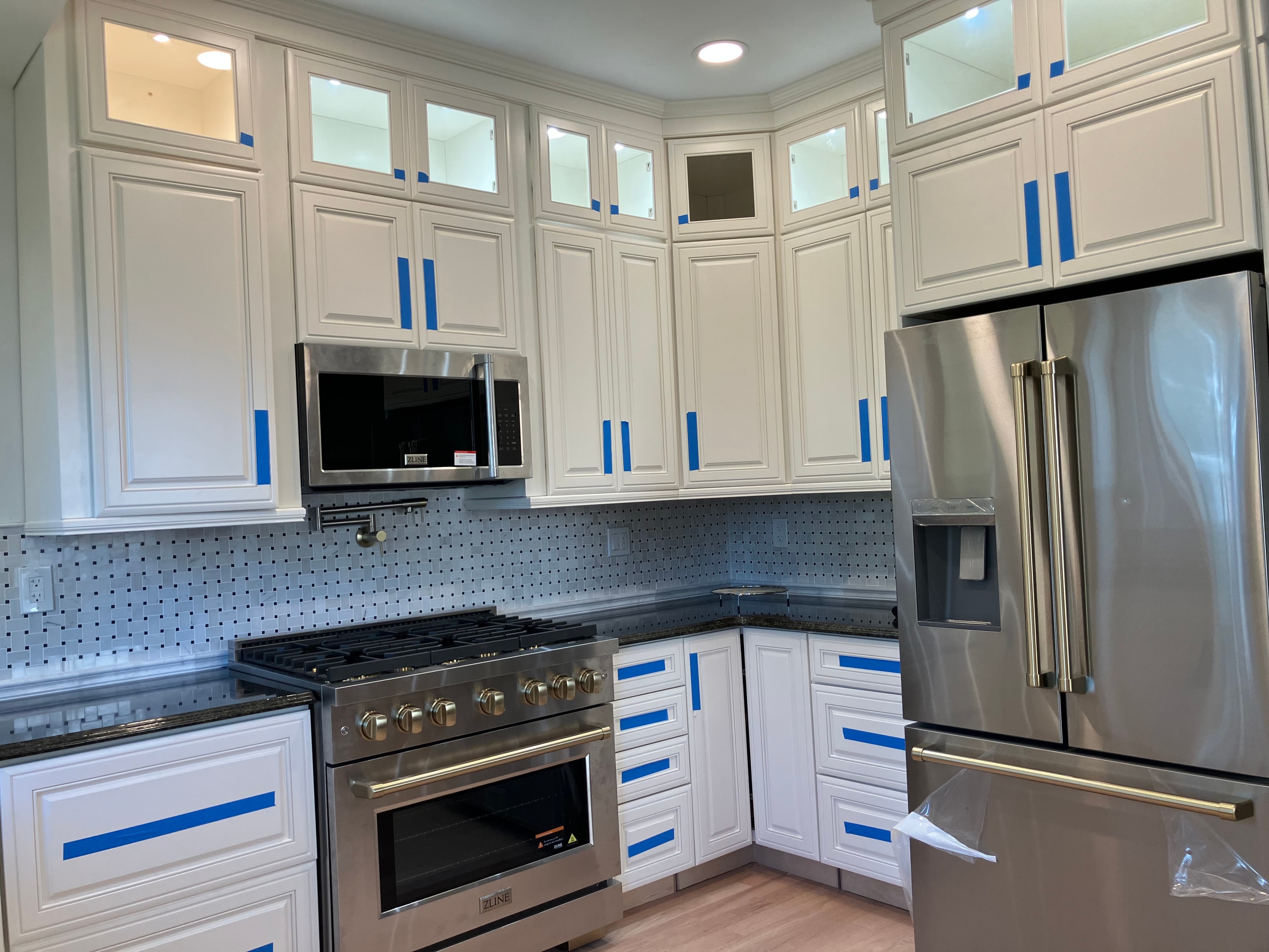 Ekar team installing kitchen cabinetry during remodel