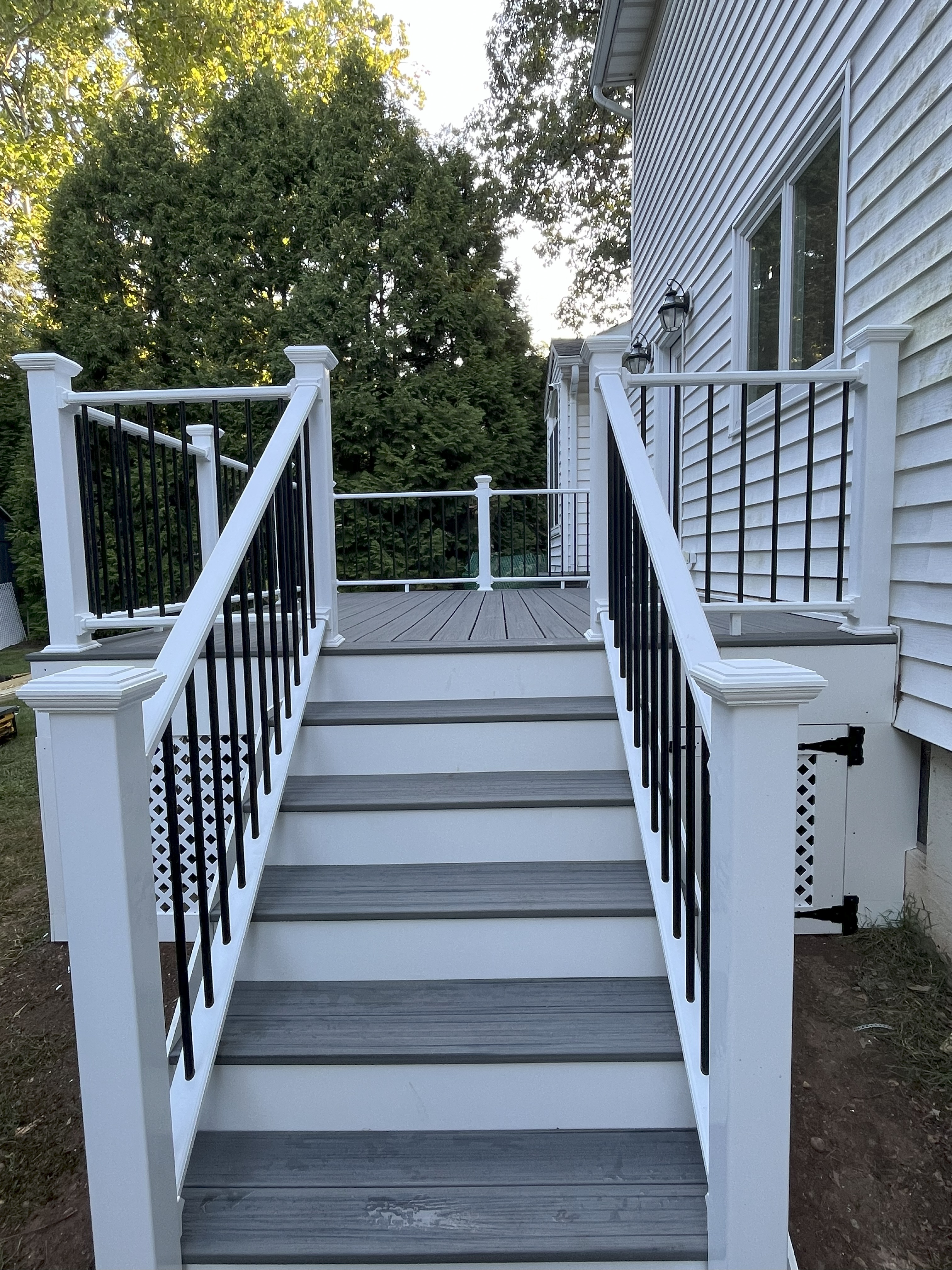 Low-maintenance composite deck with fascia trim
